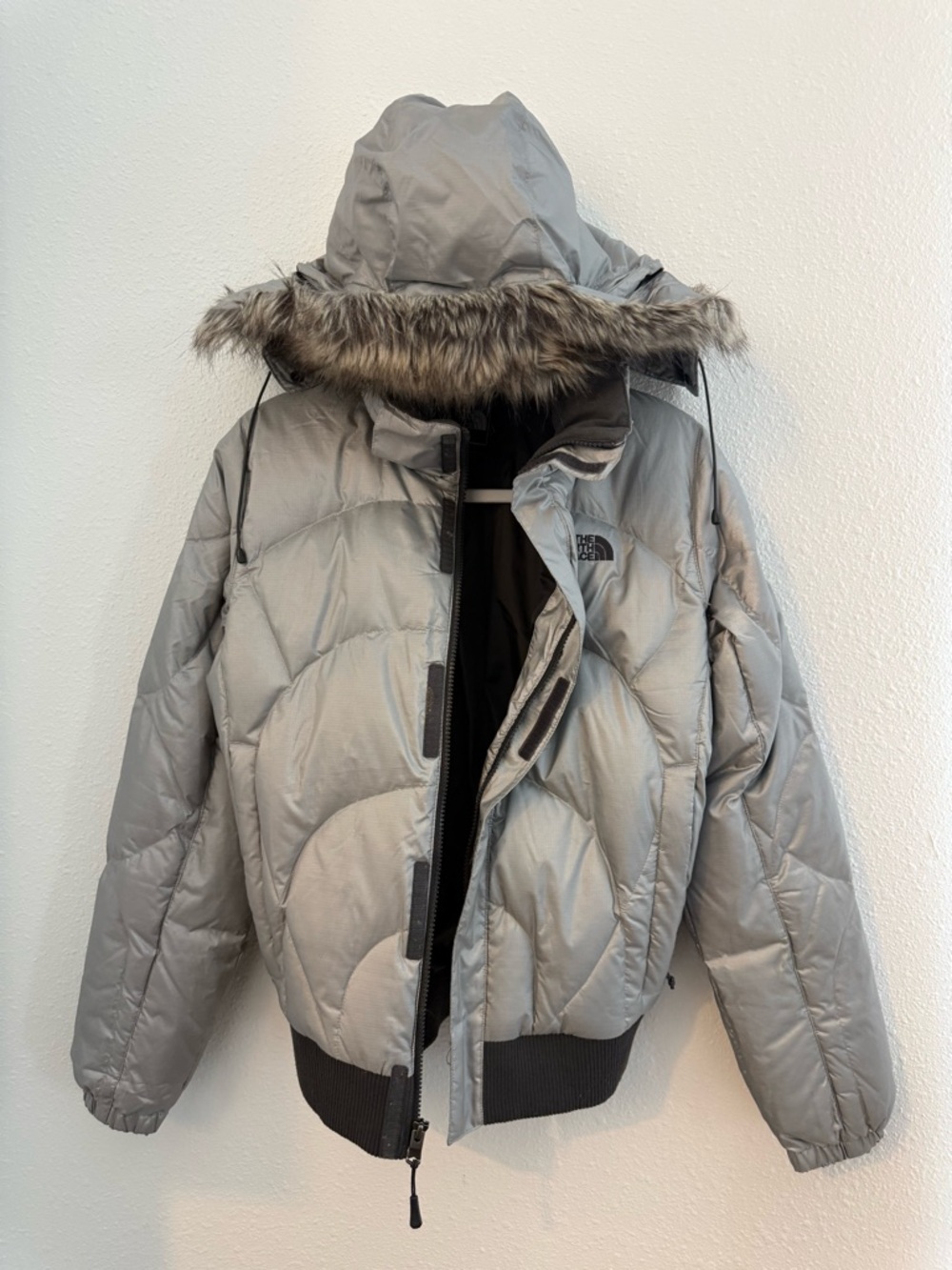 The North Face Light Silver Hooded Puffer Jacket with Faux Fur Trim